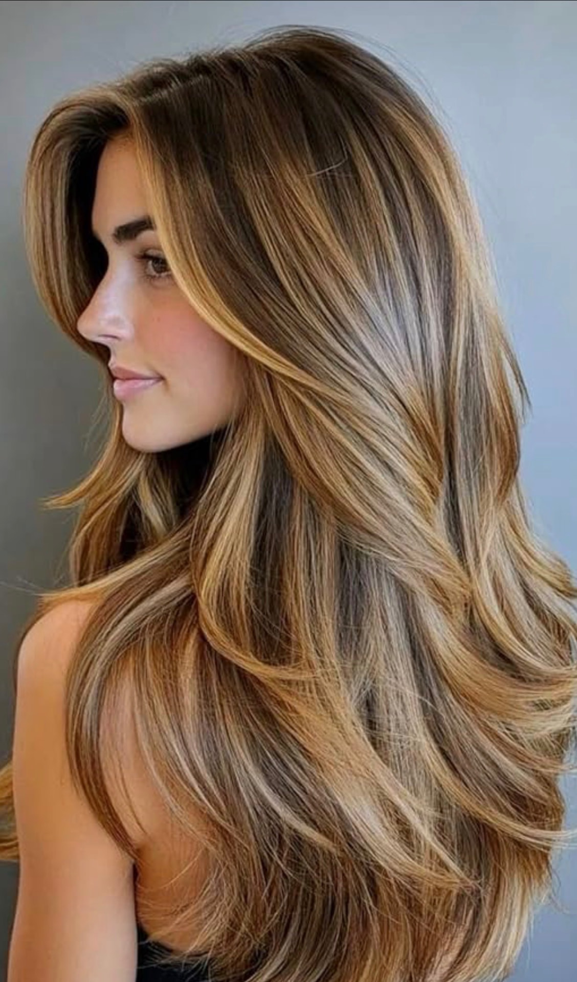 Very long, layered, dimensional blonde hair — hair extensions at Blonde Faith