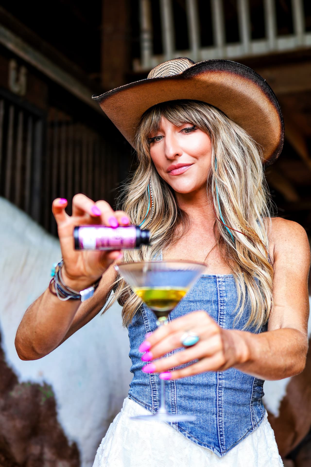 Aubree of Blonde Faith mixing a custom hair color formula by hand